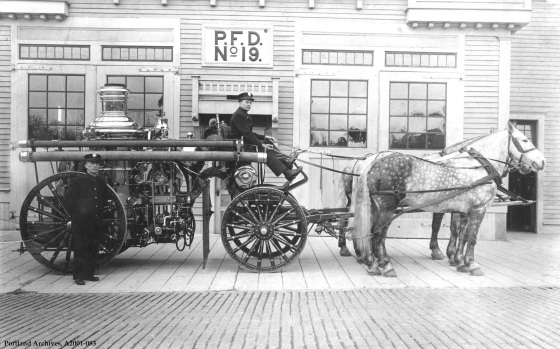 Crew and horse drawn apparatus pose outside station, circa 1910: A2001-083