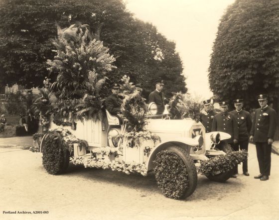 Crew pose with Squad 1 car, decorated for Rose Festival Parade, circa 1926: A2001-083